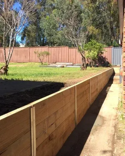 Timber retaining wall with treated pine sleepers
